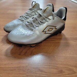 Lotto soccer cleats size 3 kids silver, black and gold. Only used for 2 months.